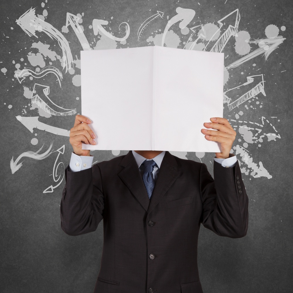 businessman with blank book and arrows choice as concept